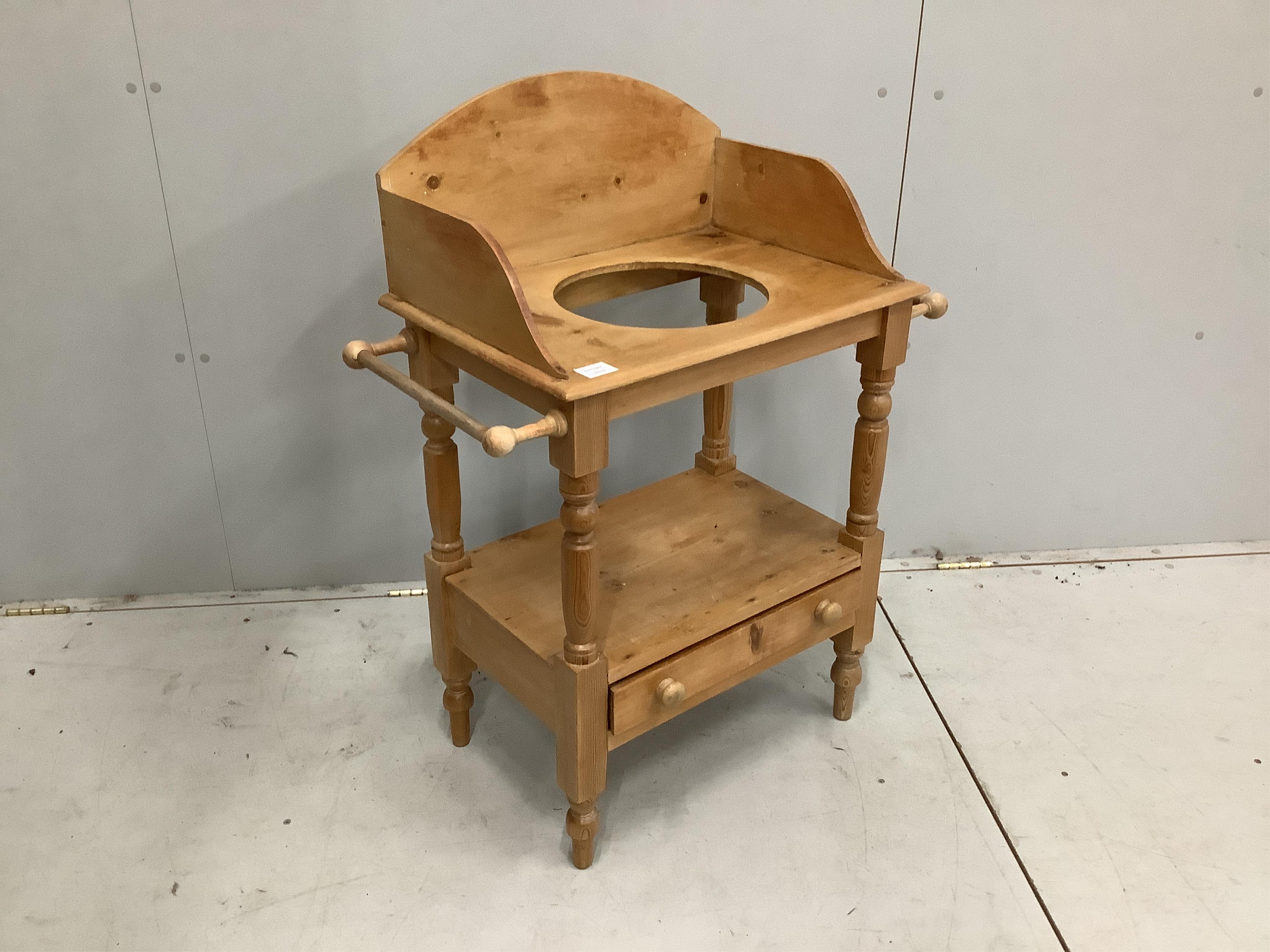 An Edwardian style pine washstand, width 77cm. Condition - faded with some cracks